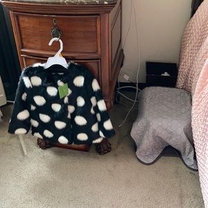 Black and white polka dot faux fur coat.